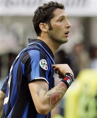 Label: and hand tattoos, Marco Materazzi with a full tribal tattoos on arm